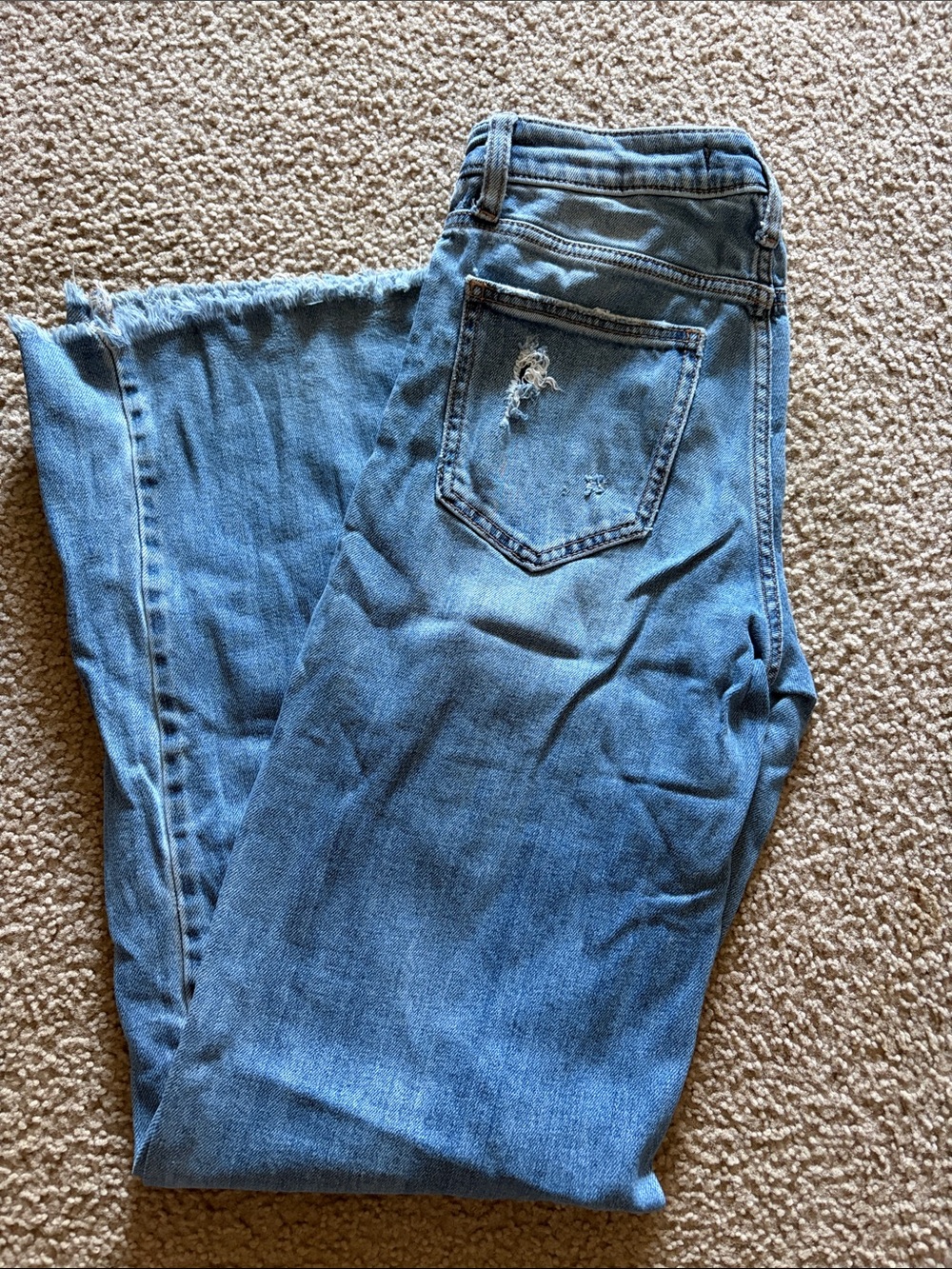 Women’s Light Blue Flared Jeans with Raw Hem